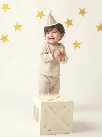 A clap and a smile! This is the pure, unfiltered joy of being one year old.