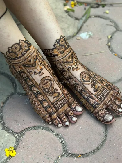 Another angle of the full bridal foot mehendi, showing how the design wraps beautifully around the feet.