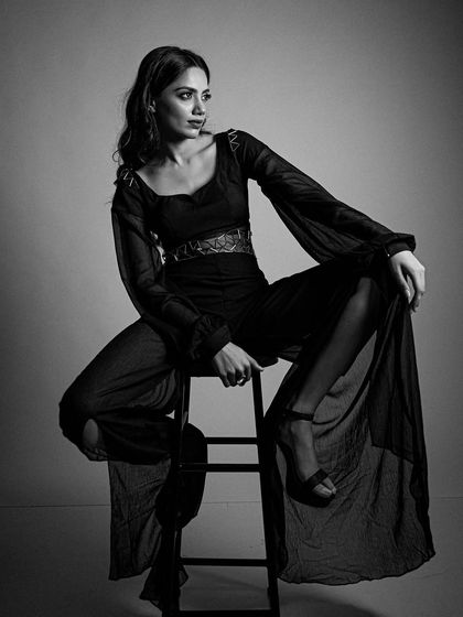 This pose showcases how the makeup looks from a different angle, maintaining its structure and elegance.