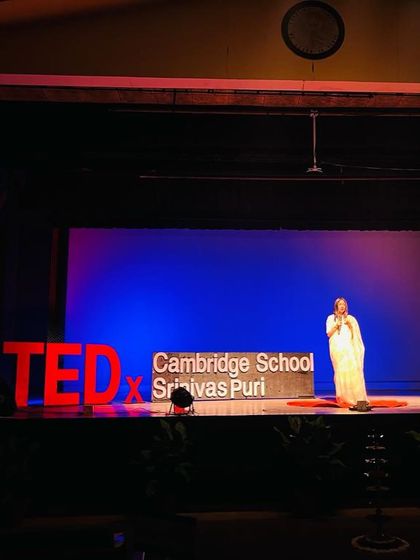 On stage for my TEDx talk about social media addiction. I addressed how the constant, unregulated exposure to devices during the pandemic led to a 400% rise in cybercrime against children.