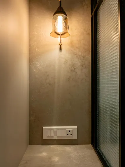 A small, warm lamp can make a corner feel special. In this appliance nook, the vintage-style lamp adds a soft glow, making the space feel inviting and connected to the rest of the home.