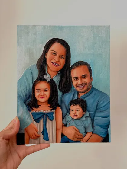 A hand-held view of the finished family portrait. I take care to capture the likeness and personality of each family member, from the parents down to the youngest child.