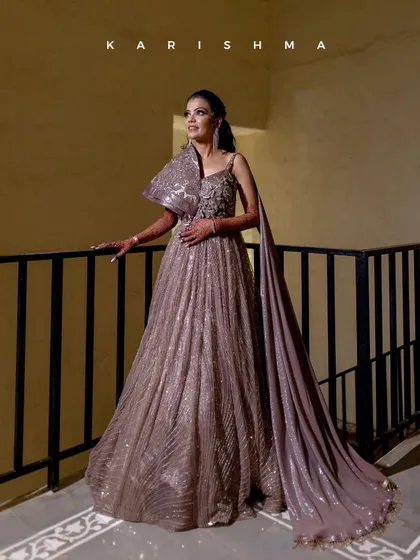 The bride, Karishma, looks absolutely radiant in her reception gown. I captured this moment on the balcony, using the soft lighting to highlight the elegance of her dress and her joyful anticipation.