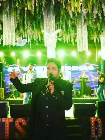 Commanding the stage at a destination wedding. My focus is on creating a dynamic and entertaining experience for everyone present.