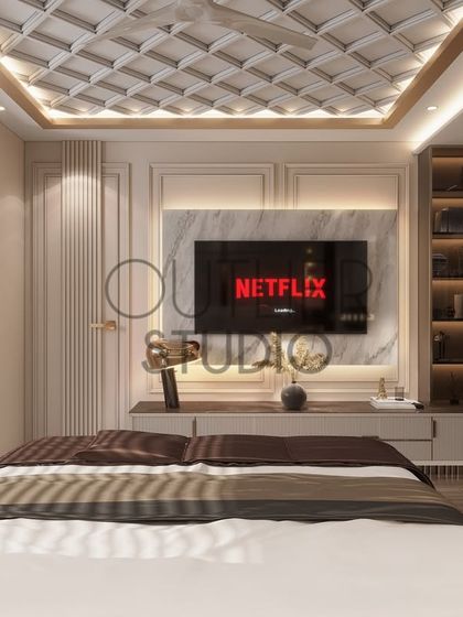 This angle of the master suite shows the view from the bed towards the media wall. The design incorporates classic wall mouldings and a stunning coffered ceiling for a touch of timeless elegance.