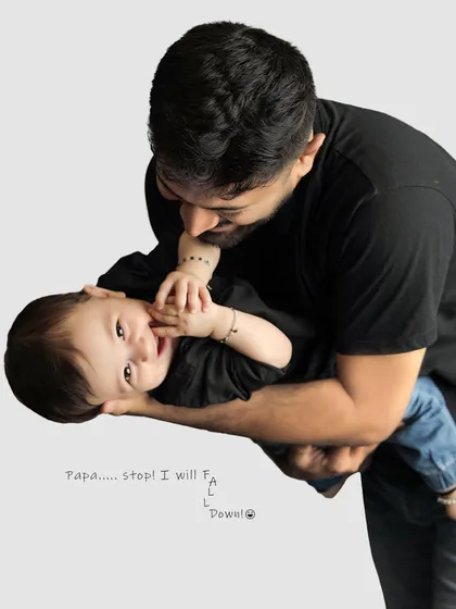 A playful moment between father and child. Capturing these fun, candid interactions is just as important as the formal poses.