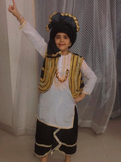 A young student dressed for a Bhangra performance. We love teaching the energetic steps of Bhangra to the next generation.