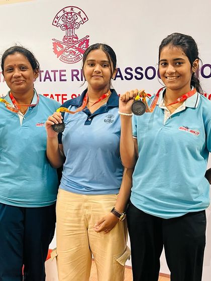 Our Air Pistol ISSF women's team proudly showing their medals after a strong performance.