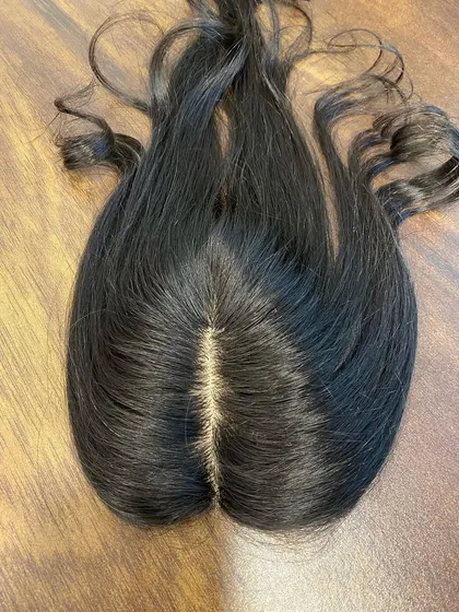The secret to an undetectable hair topper is the scalp. This is a close-up of my silk base topper, showing the realistic, hand-tied parting that looks just like your own.