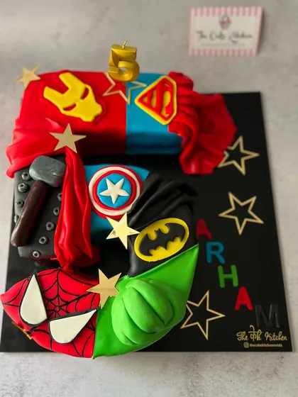 For a superhero fan's fifth birthday, I designed this Avengers-themed monogram cake. Each section represents a different hero, like Iron Man, Captain America, and The Hulk, with details handcrafted from fondant.