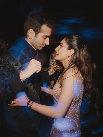 A slow dance in the middle of a high-energy party. Even with all the motion and blur, their connection is crystal clear.