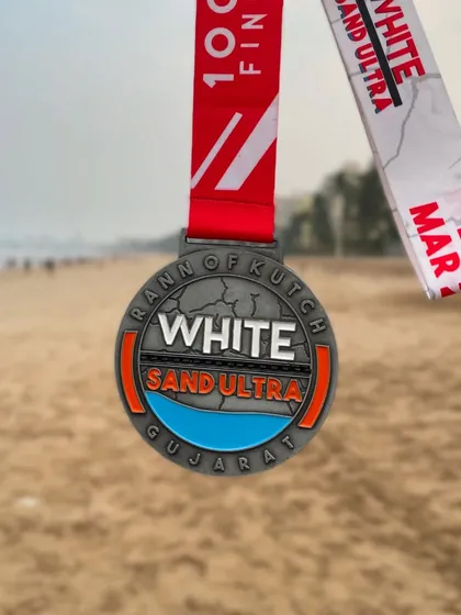 The finisher medal for the Rann of Kutch White Sand Ultra 100km. A testament to sheer mental grit and extreme endurance.