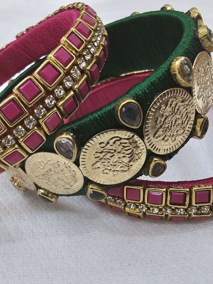 Different angles showcasing the craftsmanship of the green and ruby silk thread bridal bangle set with antique coin details.