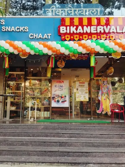 A clear, straight-on view of the tricolor balloon arch I installed for Republic Day. This shows the symmetry and impact of the decoration on a commercial storefront.