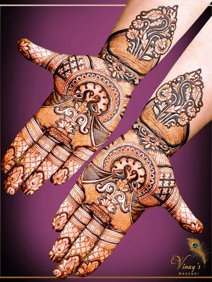 A pair of hands showing a detailed swan and lotus design, perfect for a guest of honor.