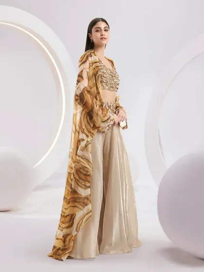 A side view of the Adoree Cape Set, showing the graceful movement and length of the stunning printed cape.