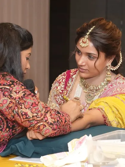 Demonstrating a bridal design on a model during a professional seminar. These events are a great way to connect with other artists.