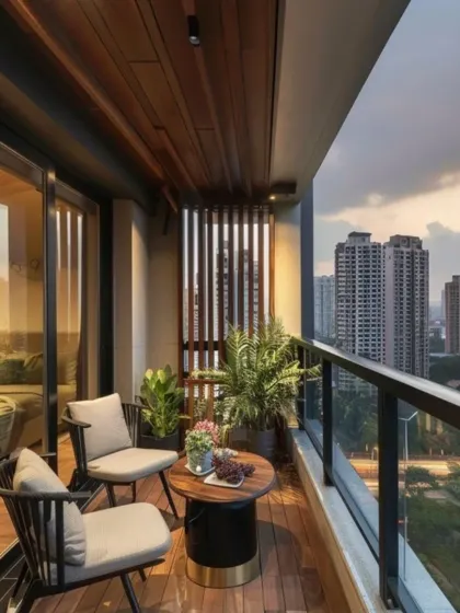 This design connects the bedroom to the outdoors with a small, intimate balcony seating area. Two modern chairs and a small table are set on a wooden deck, creating a private space for morning coffee against the city backdrop.