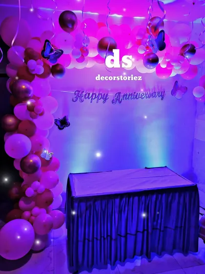 Another shot of the pink-themed anniversary backdrop, showing the sparkle effect from the lighting. We can adjust lighting to create the perfect mood for your event.