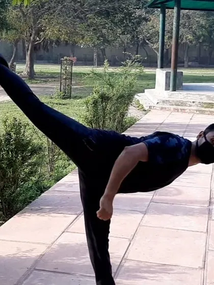 This is a demonstration of a back horse kick, a dynamic kick that targets opponents behind you. It requires excellent balance, core strength, and awareness of your surroundings.