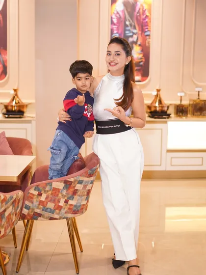 A mother and son posing in our stylish cafe area during his birthday party. Our venue's aesthetic ensures beautiful photos no matter where you are.