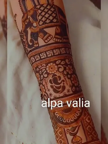A royal bridal design featuring elephants, Ganpati, and peacock motifs. This design is full of auspicious symbols for a new beginning.