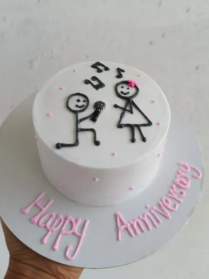 A playful stick-figure proposal design for an anniversary cake. A fun way to remember a special moment.