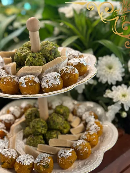 I love giving traditional Indian sweets a modern stage. This two-tiered display features classic motichoor ladoo and pista barfi, presented with a finesse that honors their heritage.
