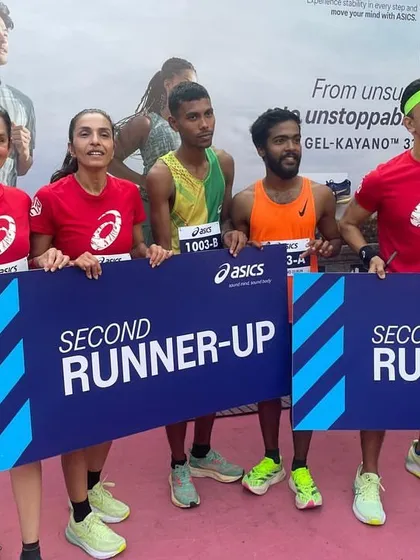 The full team celebrating their third-place finish. Moments like these highlight the power of teamwork and shared goals in competitive running.