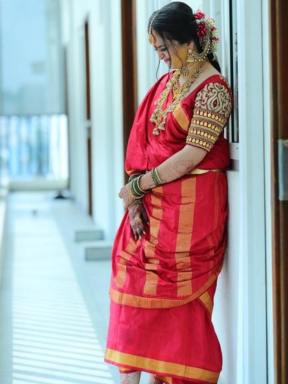 A graceful pose from my Iyer bride. The traditional nine yard saree drape is perfectly complemented by the classic makeup and gold jewellery.