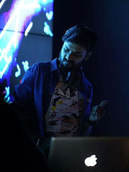 My motto is "Mind & Grind." This shot captures my focus during a set. I'm constantly reading the room and adjusting the music, ensuring the energy never dips on the dance floor.