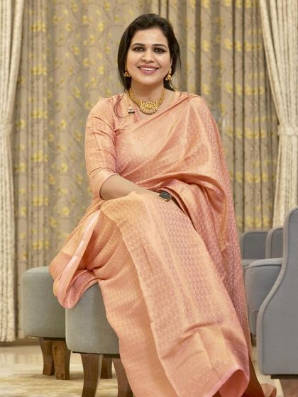 Another shot of this beautiful peach silk saree. The soft color and rich fabric make it a very graceful and elegant choice.