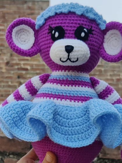 A close-up of the custom-colored monkey doll, featuring a cute frilly skirt.