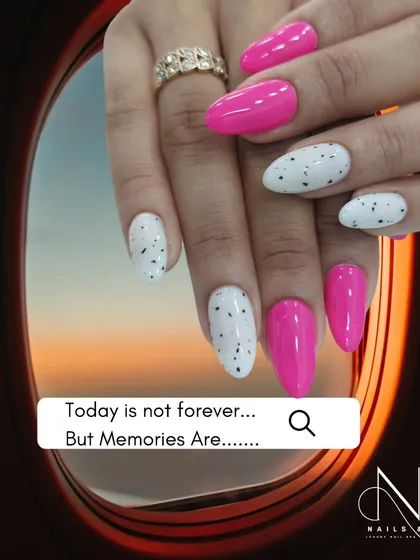 This fun design pairs a hot pink with a white speckled accent nail, reminiscent of a quail's egg. It's a playful and unique combination.