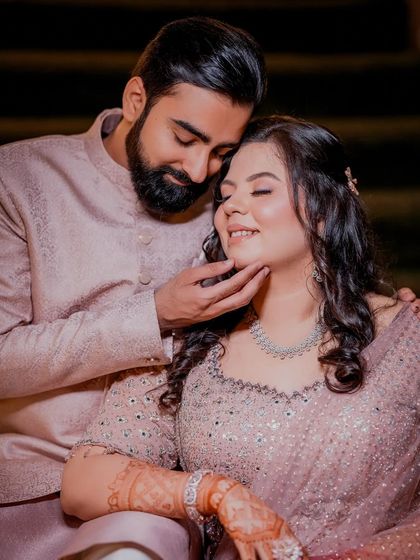A close-up shot from a Roka ceremony, focusing on the couple's tender connection. The soft lighting and their happy expressions make this a cherished memory.