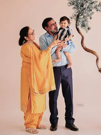 Because birthdays are a family celebration, we always encourage everyone to join in. Capturing this beautiful moment with grandparents creates a timeless family portrait that will be cherished for generations.