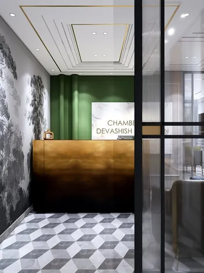 The reception area of the lawyer's office, seen through a glass partition. The design is detailed yet not overdone, creating a positive and professional experience for visitors from the moment they arrive.