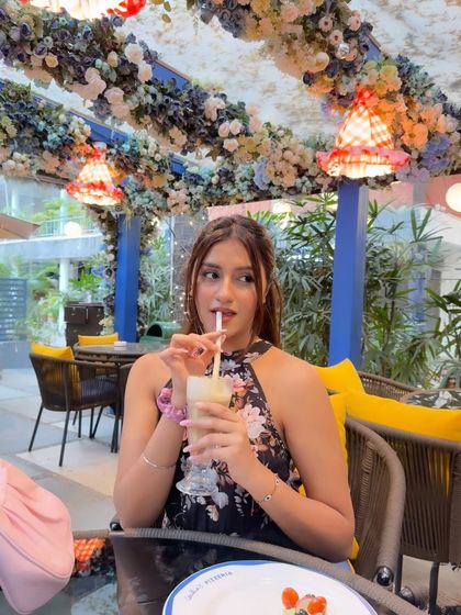 "In all things, give thanks." A moment of gratitude at a beautifully decorated cafe with floral ceilings.