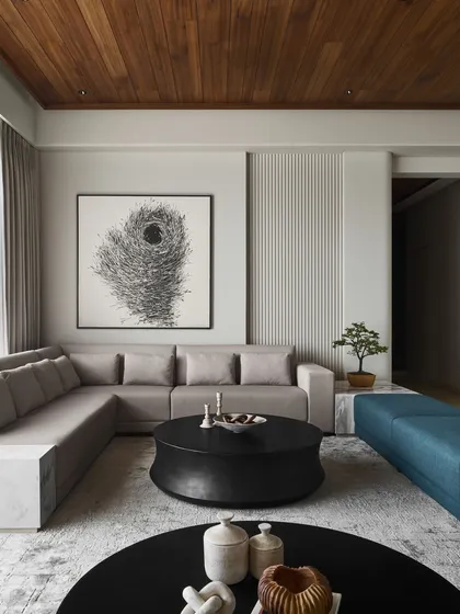 This living room showcases a complete vision of quiet luxury, featuring several of my custom pieces. The "Orbit" coffee tables, made from black concrete, introduce organic curves that contrast with the room's clean lines, creating a space that is both sophisticated and inviting.