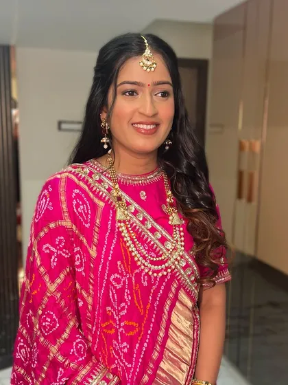 A beautiful look in a traditional pink bandhani saree, perfect for any festive occasion.