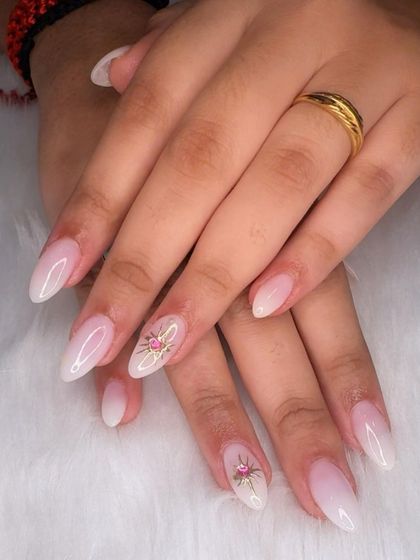 A full view of the delicate and dreamy starburst nail art.