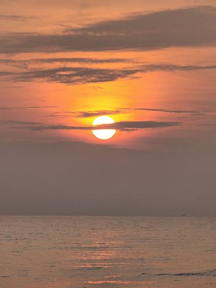 A spectacular sunset over the Arabian Sea. At the end of each day on our West Coast Odyssey, you can relax on a private beach and watch the sun go down.