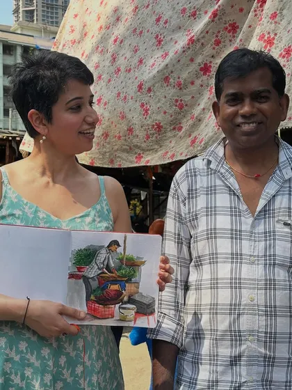 One of my favorite things is connecting with people through my art. Here I am with a local vegetable vendor after sketching him at his stall. Seeing the joy on someone's face when they see themselves captured in a sketch is the best feeling.