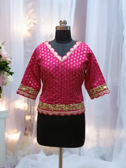 Another view of this elegant pink long choli. Its V-neck and embroidered borders add a touch of sophistication, making it a versatile addition to your ethnic wardrobe.