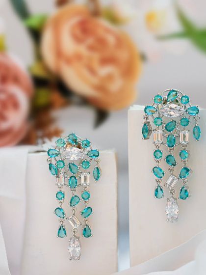 I shot these turquoise and diamond earrings with a soft, romantic feel, letting their elegance meet a dreamy, floral backdrop. For me, product photography should often feel like poetry in pictures.