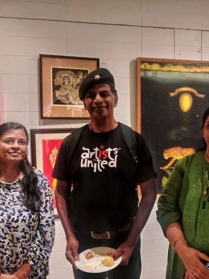 Sharing a moment with fellow artists at the World Art Day celebration.