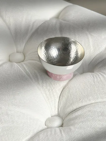 The simple elegance of my rose quartz base bowl, shown here against a soft, textured background. It is a versatile piece that exudes quiet luxury and modern design.