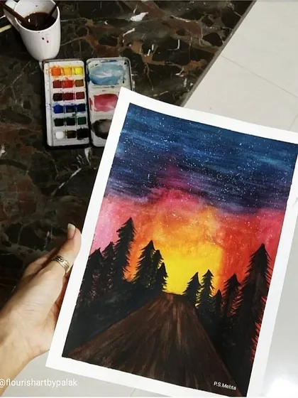 Another view of the starry night watercolor, showing the texture of the paper and the vibrant pigments of the paint palette I used.