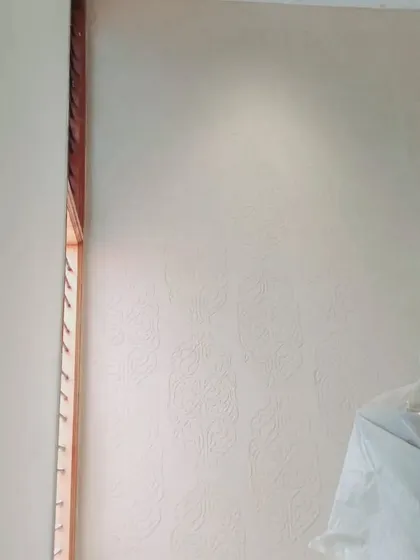 Here you can see a subtle, tone-on-tone textured pattern applied to a large wall. This "flesh painting" technique adds depth and interest to the wall surface without relying on a bold colour.