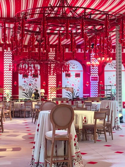 Inspired by the vibrant aesthetics of Jaipur, this 'Laal Ishq' theme uses a bold palette of red and white. The entire space, from the custom chandeliers to the block-print motifs and table settings, was designed to create a symphony of color and romance.